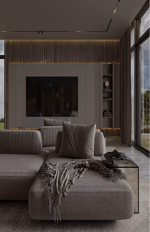 Modern living room with gray sectional sofa, textured cushions, a throw blanket, glass side table, and large floor-to-ceiling windows.